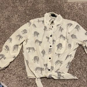 White shirt with black leopards
